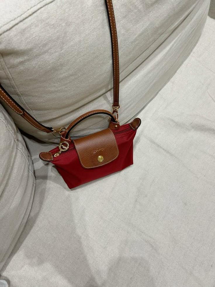 Red Longchamp mirror bags