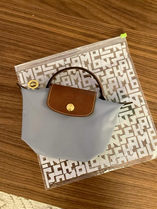 Grey Longchamp mirror bags